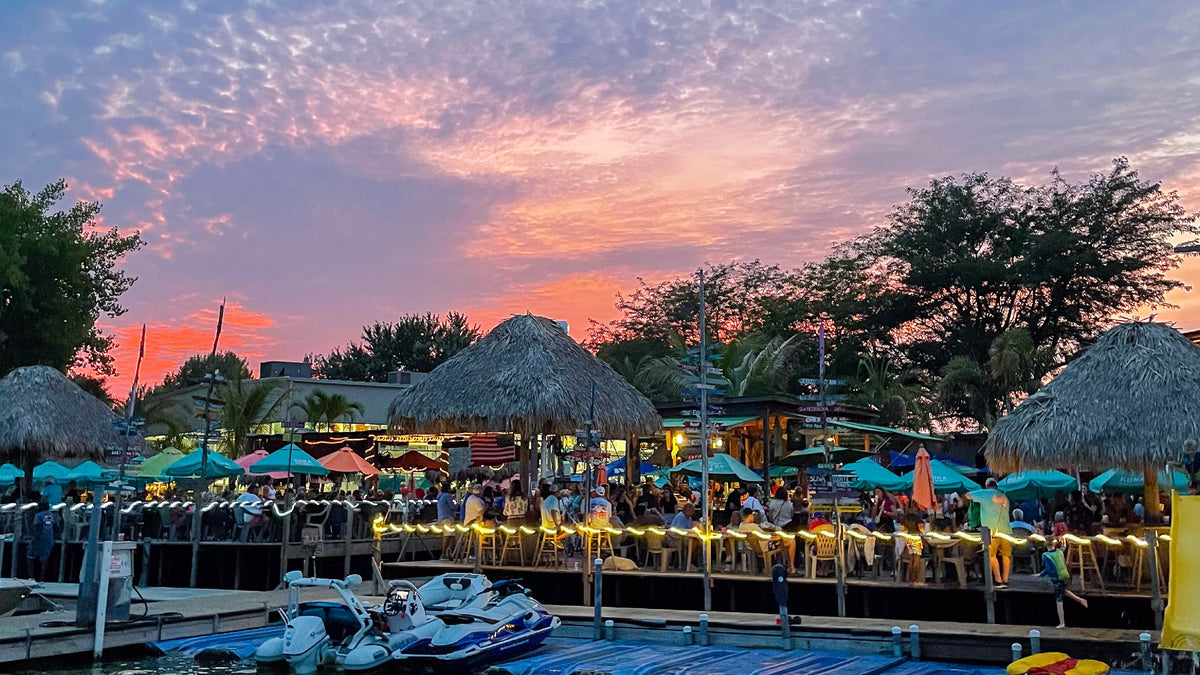 Lakeside view and sunset at the Barefoot Bar in Okoboji, Iowa.